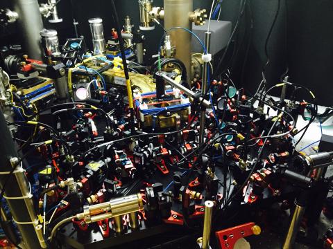 The optics setup to produce the optical quasicrystal. The glass cell containing the BEC sits under the brass block visible in the middle.