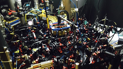 The optics setup to produce the optical quasicrystal. The glass cell containing the BEC sits under the brass block visible in the middle.